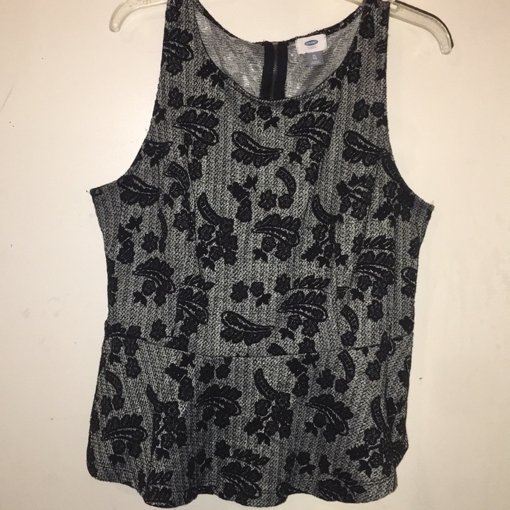 This is a black and grey sleeveless shirt.